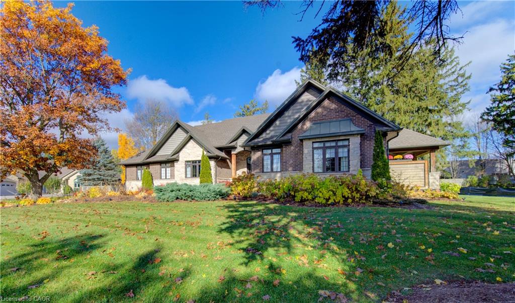 Craftsman style home with mature landscaping