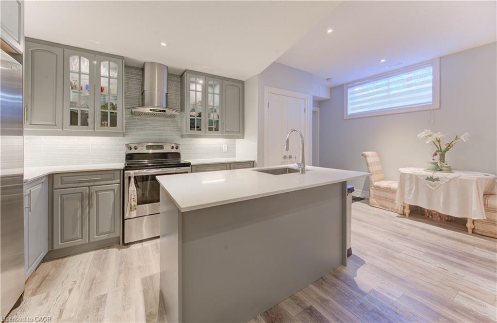 Lower level kitchen with island and natural light
