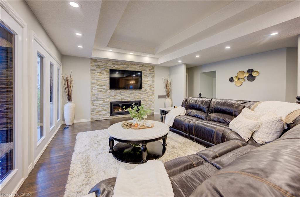 Open concept family room with stone fireplace