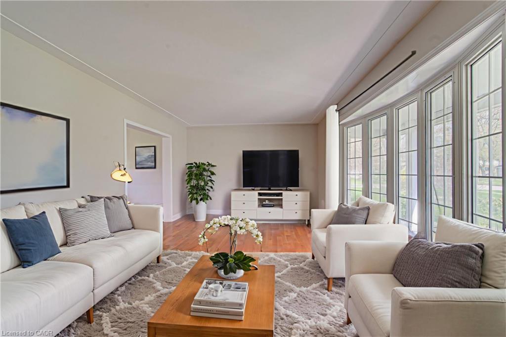 Bright living room with large windows and neutral palette