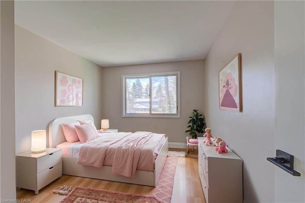 Children's bedroom with soft pink decor and bright window